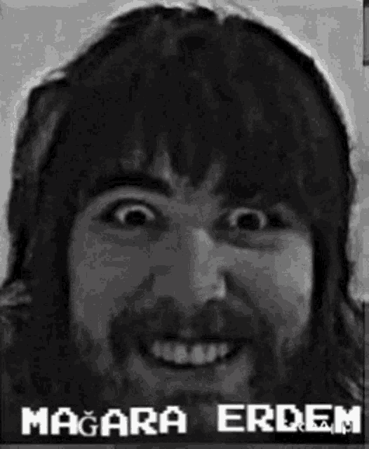 a black and white photo of a man with a beard and the name madara erdem