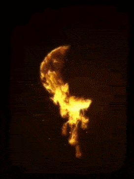 the letter g is surrounded by flames on a black background .