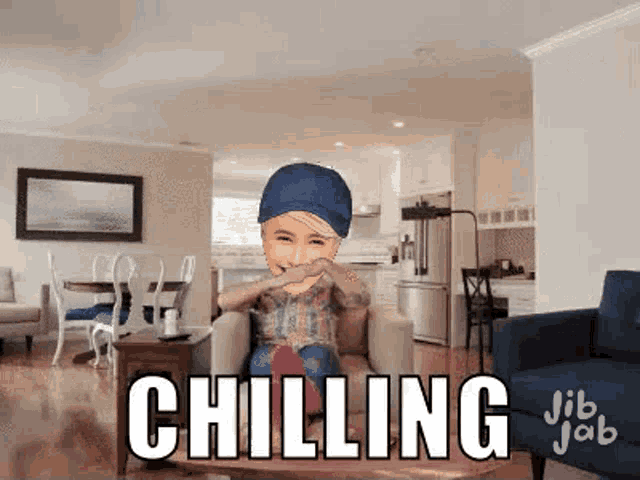 a person is sitting in a chair in a living room with the word chilling written on the bottom .