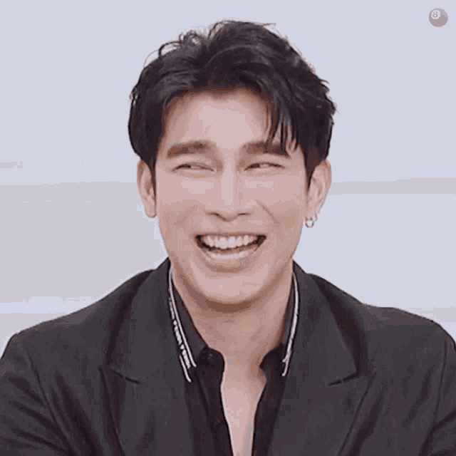 a close up of a man 's face with a smile on it