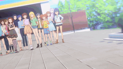 a group of anime girls are posing for a picture with one girl wearing a yellow shirt that says ' a ' on it