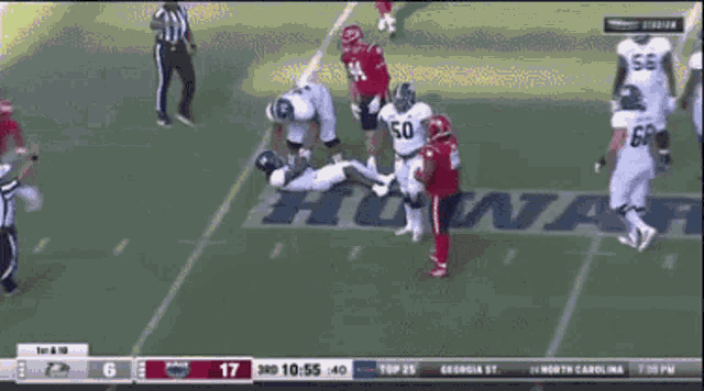 a football game is being played in a stadium with the score 17 to 17