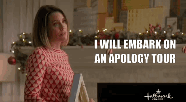 a woman is standing in front of a fireplace holding a book and says `` i will embark on an apology tour ''