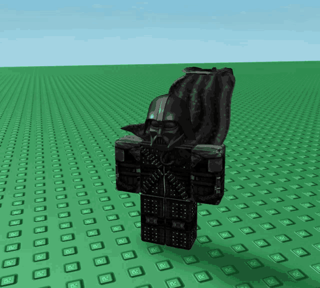 a statue of darth vader is standing on a green background