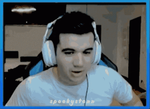 a man wearing headphones and a white shirt with the word spooky on the bottom