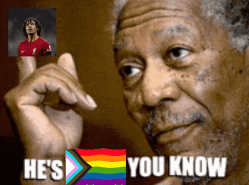 an older man says he 's you know in front of a picture of a man in a red shirt