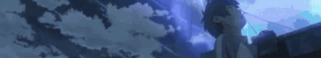 a girl is standing in front of a blue sky looking up at the clouds .