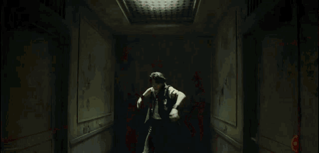 a man is jumping through a hallway in a building .