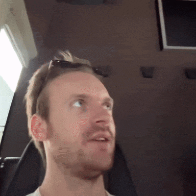 a man with sunglasses on his head looks up