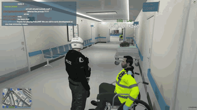 a police officer talks to a man in a wheelchair