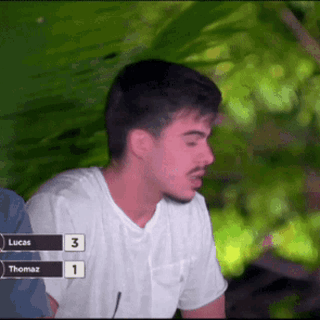 a man in a white shirt has the number 3 and 1 on his shirt