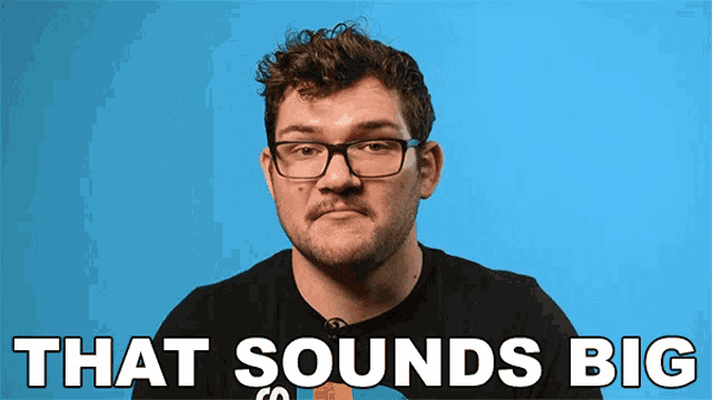 a man with glasses says that sounds big in front of a blue background
