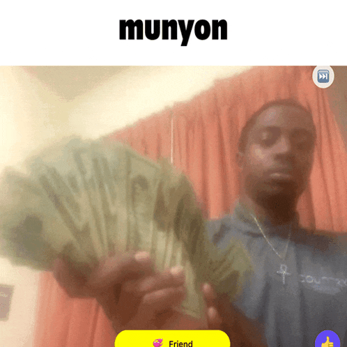 a man is holding a bunch of money and the word munyon is on the bottom