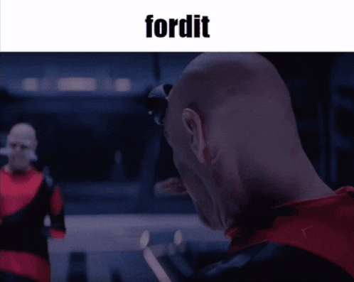 a man in a red shirt is looking at another man in a black suit and the word fordit is above him