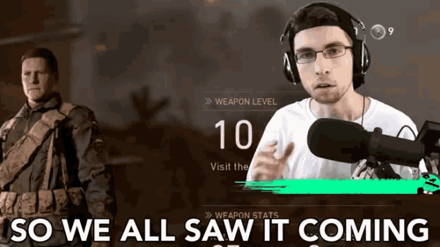a man wearing headphones stands in front of a microphone with the words so we all saw it coming