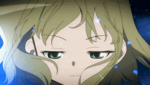 a close up of a person 's face with green eyes