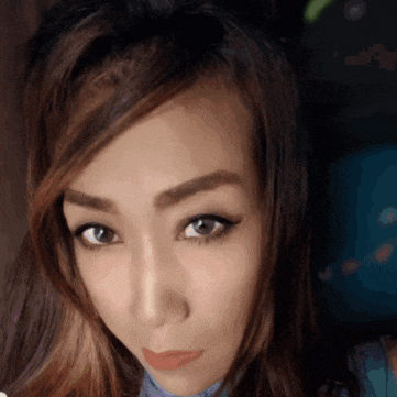 a close up of a woman 's face with her eyes closed