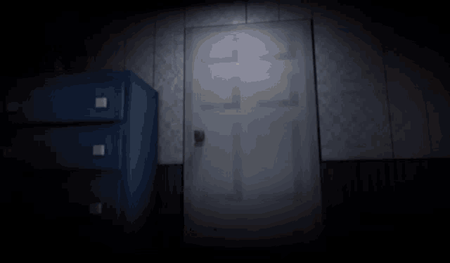 a door with a yellow sticker on it is open in a dark room