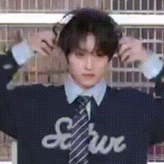 a man wearing a shirt and tie with the word serve written on it .