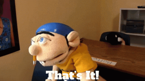 a puppet says that 's it while holding a pencil in his mouth