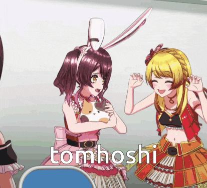 a girl with bunny ears is standing next to another girl with the word tomhoshi on the bottom
