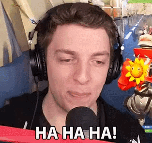 a man wearing headphones is laughing into a microphone with the words ha ha ha written on the bottom