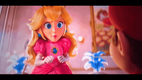 a princess peach doll is standing next to a man in a room .