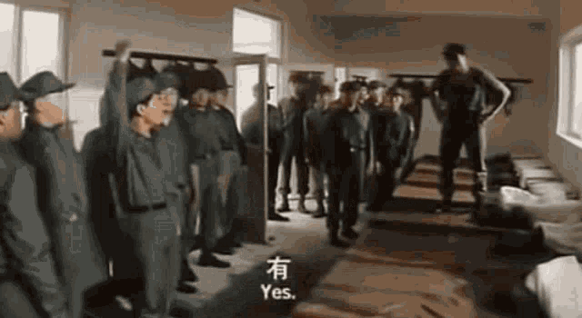 a group of soldiers are standing in a room in a military base .