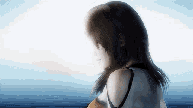 a woman with long hair is standing in front of a blue ocean