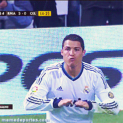 a soccer player wearing a white adidas jersey is standing in front of a scoreboard