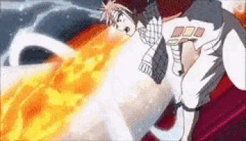 a person is laying on a couch with a fire coming out of their mouth .