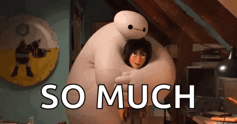 a cartoon character from big hero 6 is hugging a boy .