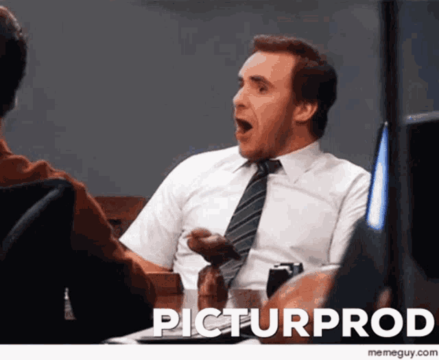 a man in a white shirt and tie is sitting at a table with the word pictur prod written on the bottom