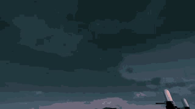 a dark blue sky with a few clouds