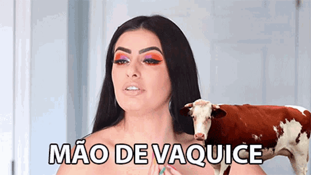 a woman standing next to a brown and white cow with the words mao de vaquice on the bottom