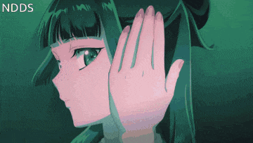 a girl with green hair is covering her face with her hand and the word ndds is visible in the corner