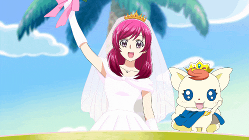 a girl in a bride 's dress is standing next to a cat