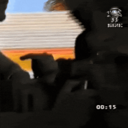 a blurred image of a person with the time 00 15