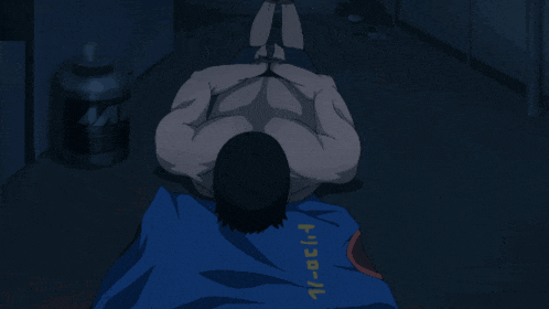 a man is laying on the floor with a blue shirt that says 1/oct-1