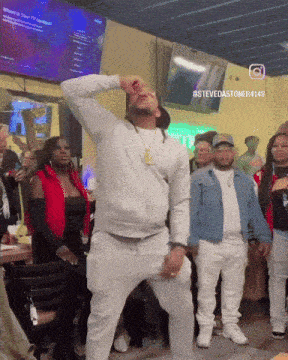 a man is dancing in front of a crowd with the hashtag stevedastoner414b on the bottom