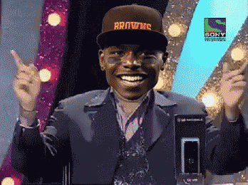 a man wearing a hat that says browns is giving a thumbs up