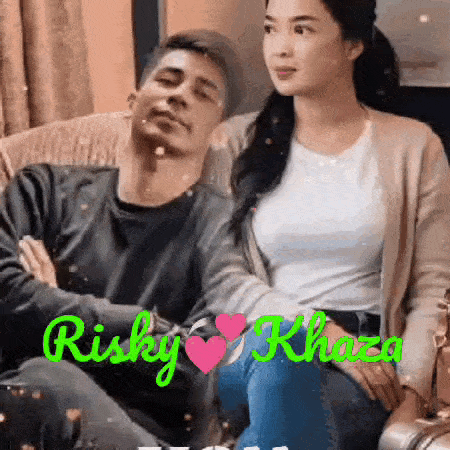 a man and a woman are sitting on a couch and hugging each other .
