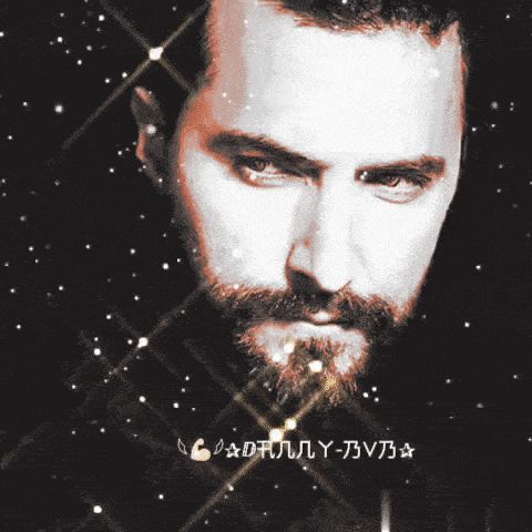 a close up of a man 's face with a beard and the word candlely written on the bottom right