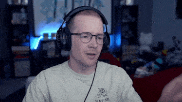 a man wearing headphones and a shirt that says nkfsb