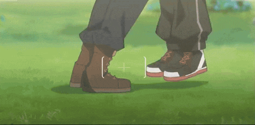 a couple 's legs are shown in a blurry photo with the letters i and j visible in the corner