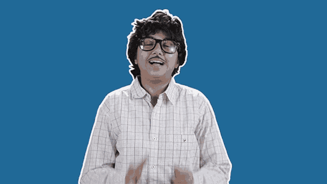 a man with glasses is praying with his hands folded in front of his face