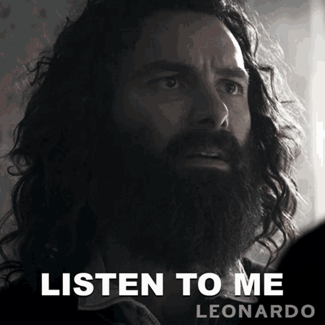 a man with long hair and a beard says listen to me