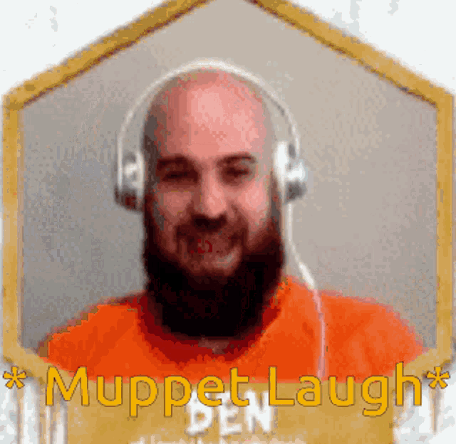 a bald man with a beard wearing headphones and the name muppet laugh behind him