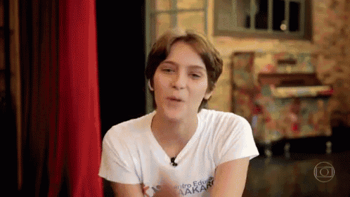 a young woman wearing a white shirt that says centro edu lakary