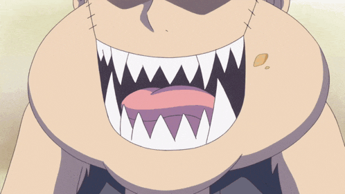 a close up of a person eating a donut with sharp teeth